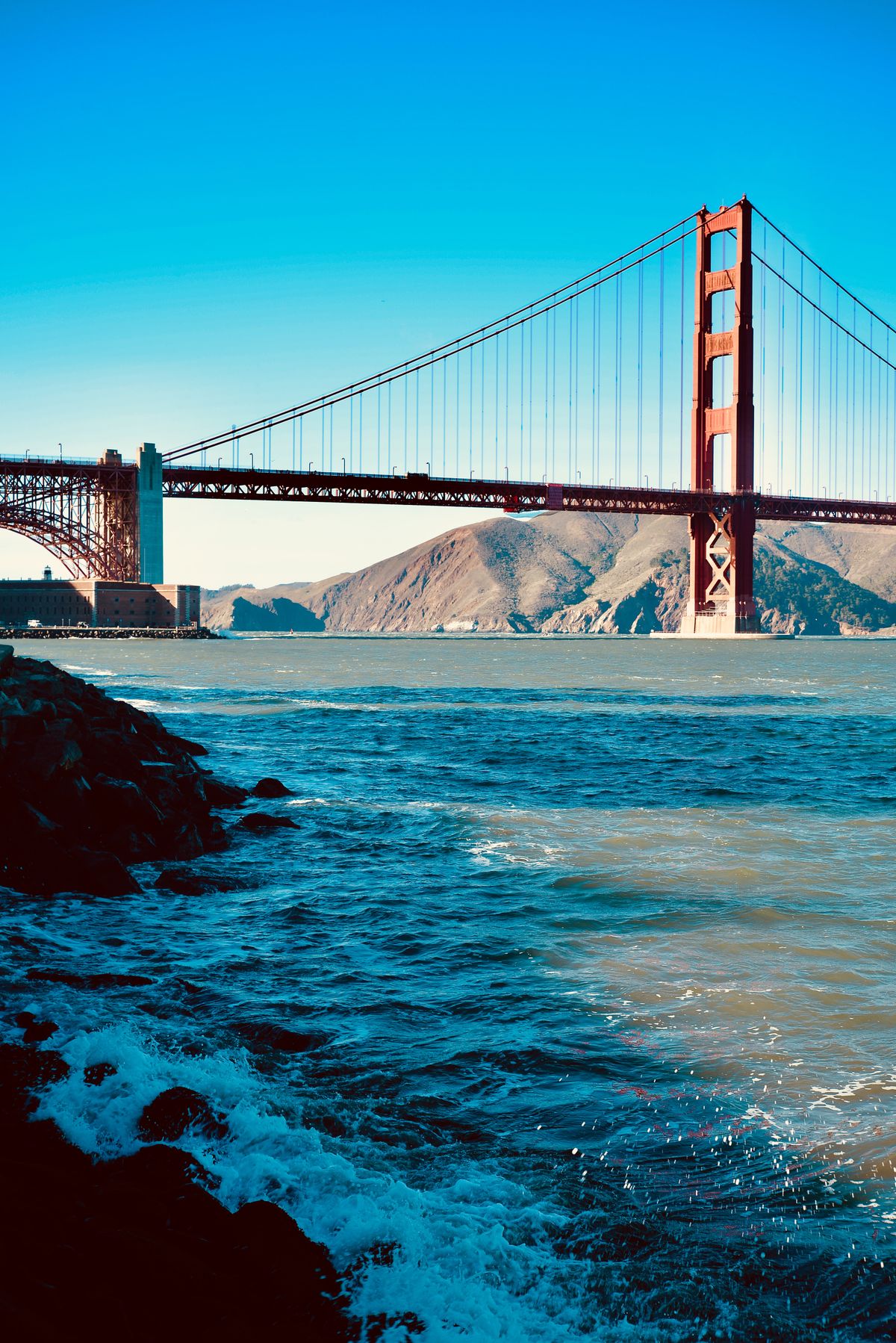 The Golden Gate Bridge above fog in San Francisco Bay