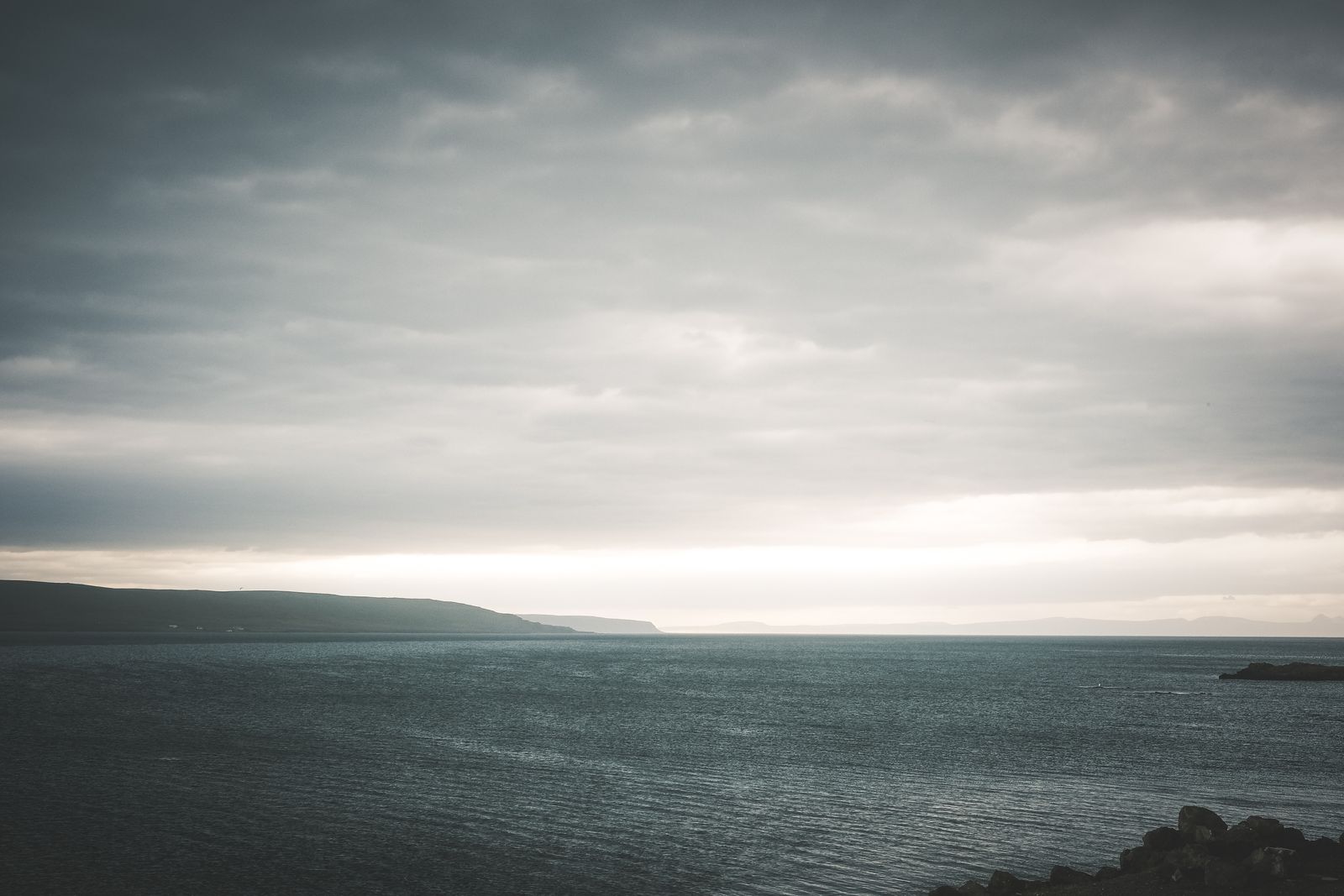 Muted coastal seascape under an overcast sky by Peter Holmboe on Pexels