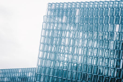 The striking glass facade of Harpa Concert Hall in Reykjavik, Iceland, showcasing modern architecture.