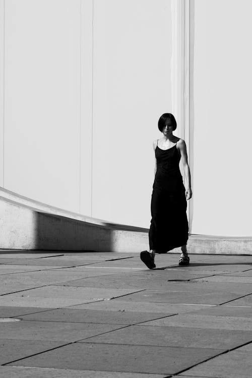 Woman in a Black Dress Walking