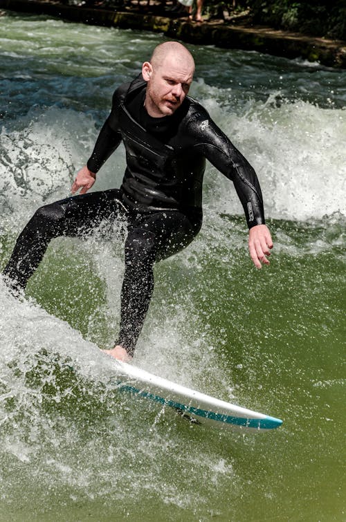 Man in Costume Surfing on Board