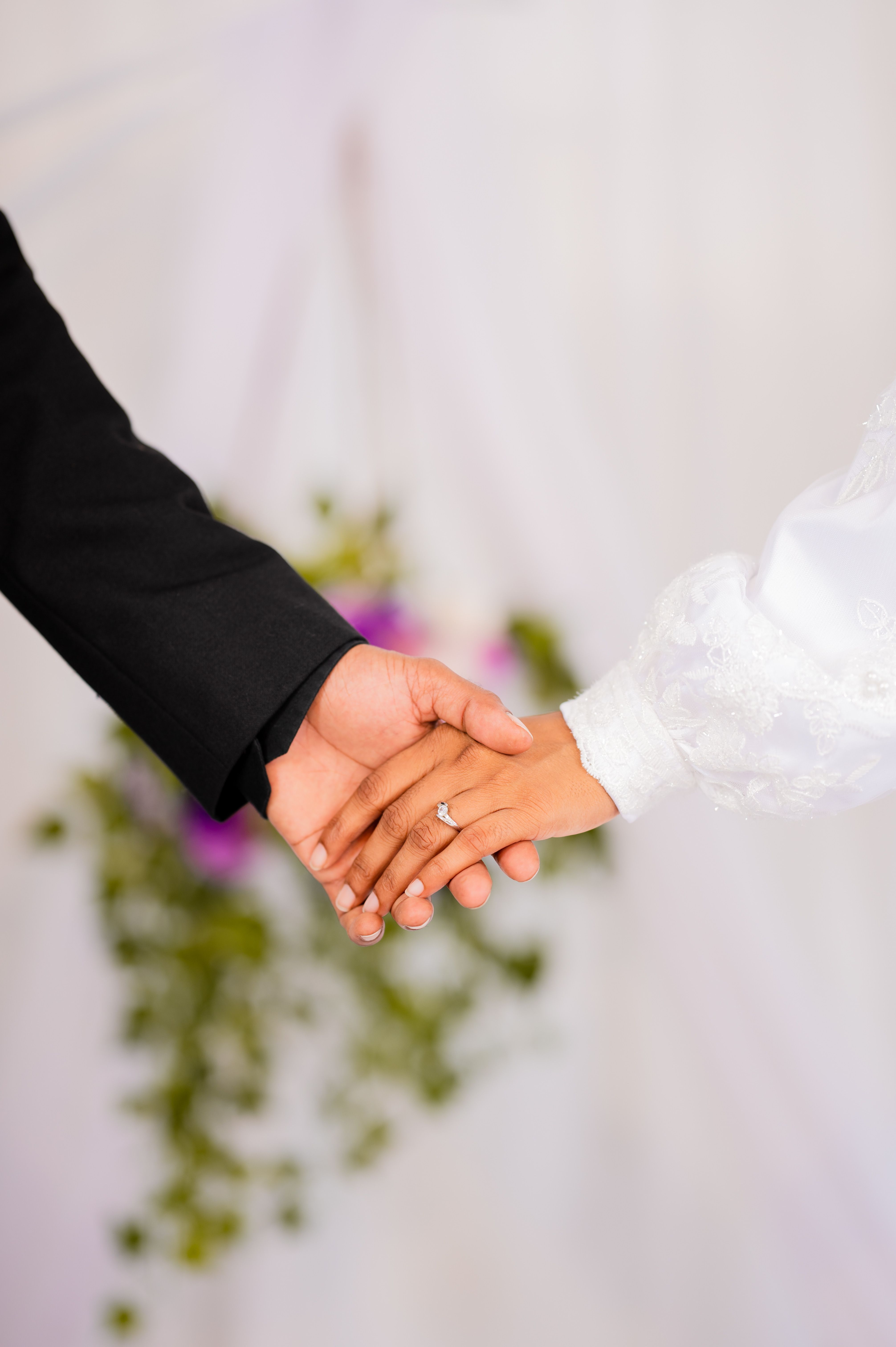 Hands of the Bride and Groom with an Engagement Ring · Free Stock Photo