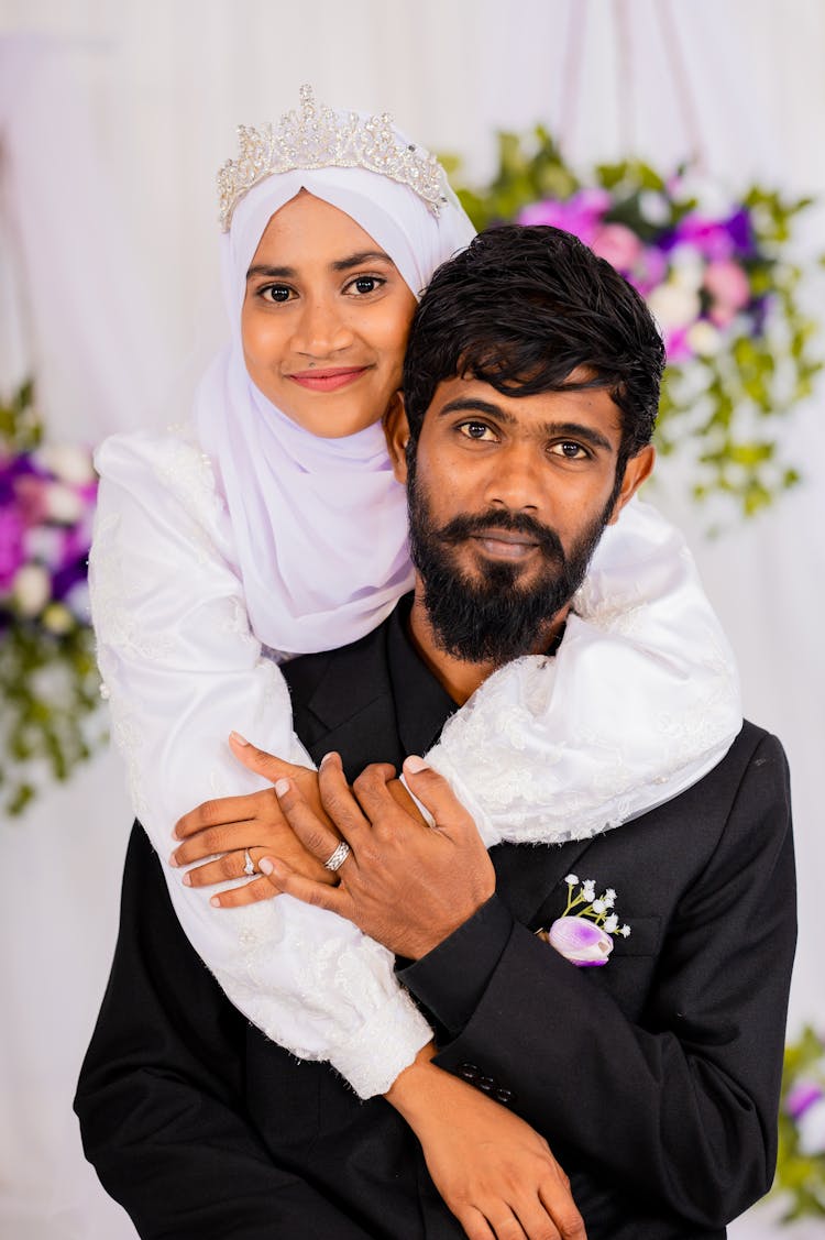 Smiling Bride And Groom Hugging On Wedding Ceremony