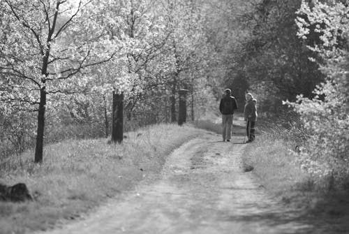 Man and Woman on Rural Dirt Road 