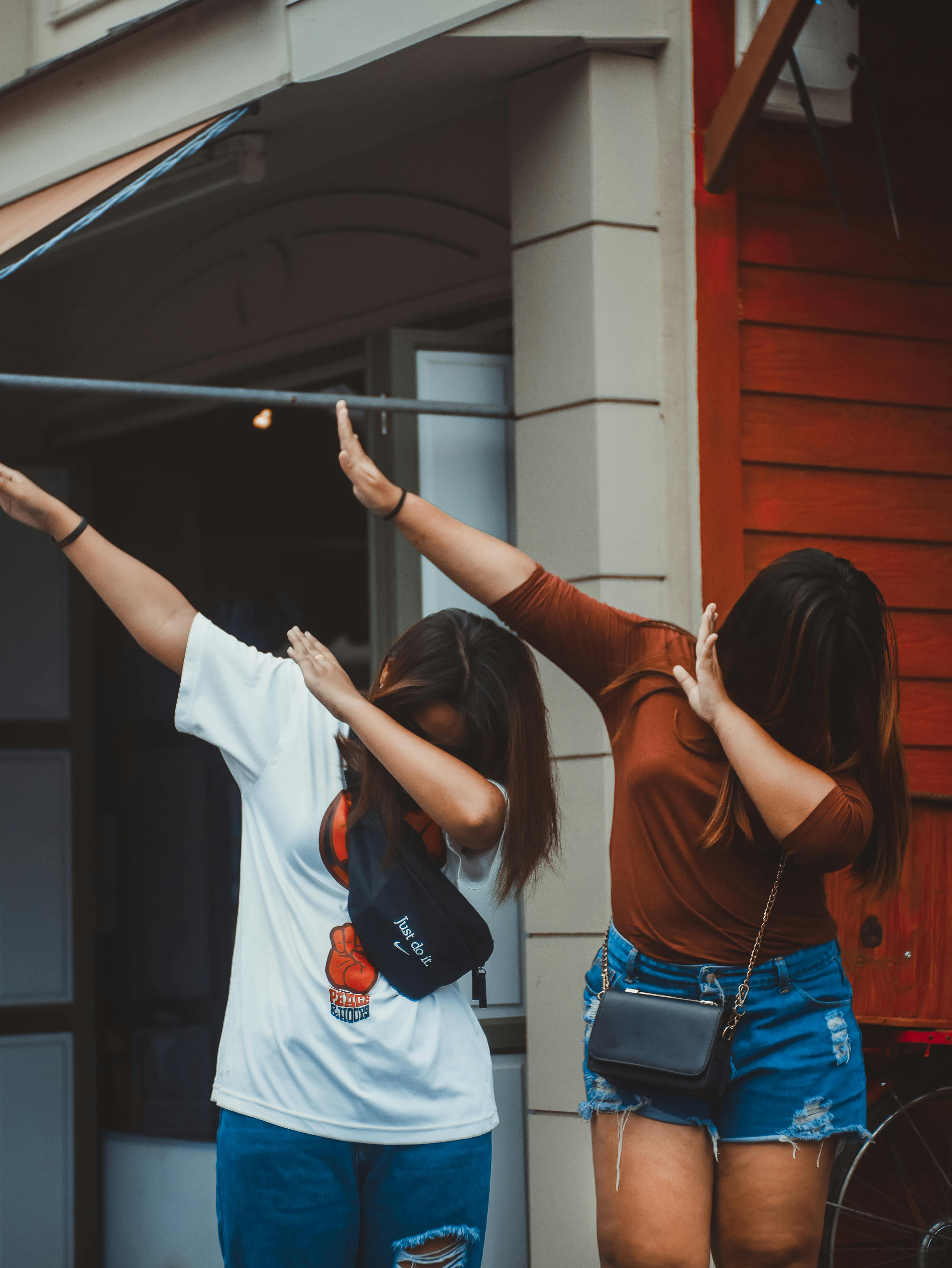 photo of two women dancing