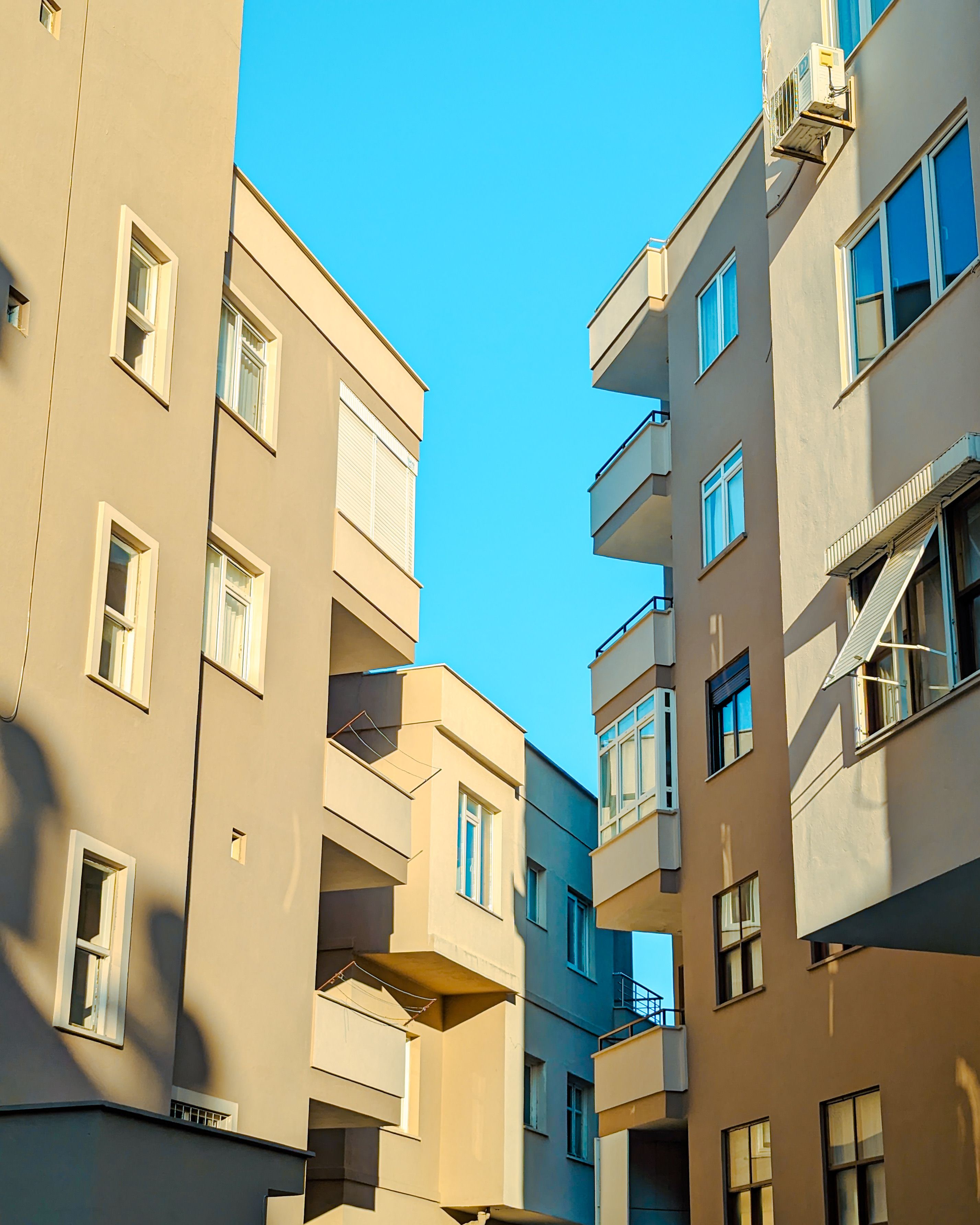 Residential Buildings against Blue Sky · Free Stock Photo