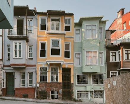 Charming colorful residential buildings lining an urban street, showcasing diverse architectural styles.