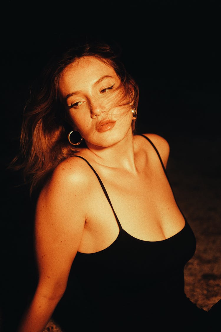 Brunette Woman Posing In Black Strap Dress 