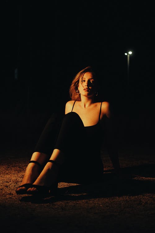 Woman in Black Pants Posing at Night