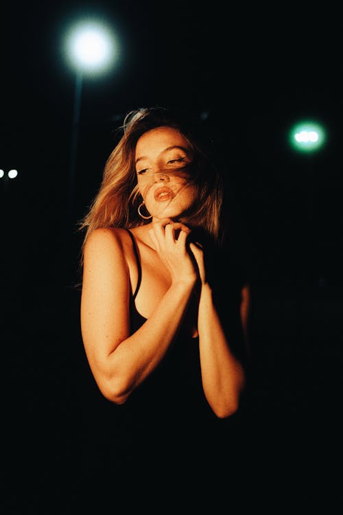 Young Woman on the Street at Night