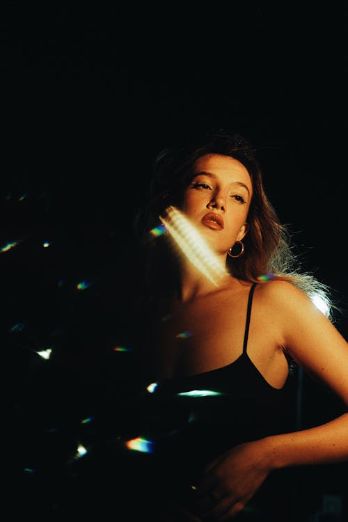 Young Woman Posing in Black Spaghetti Strap at Night