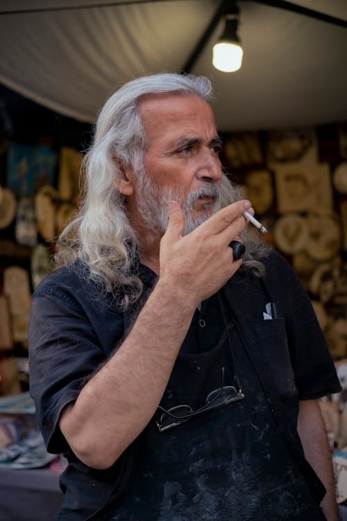 Portrait of a Senior Man Smoking a Cigarette