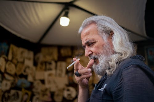 Senior Man Smoking a Cigarette