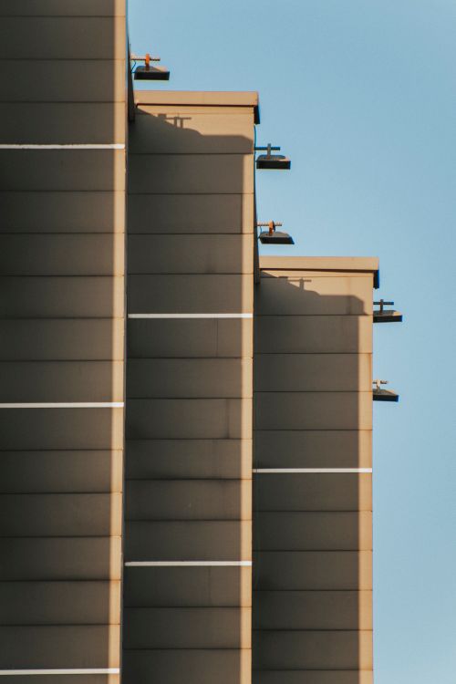 Free Minimalist facade of modern residential building under clear blue sky. Stock Photo