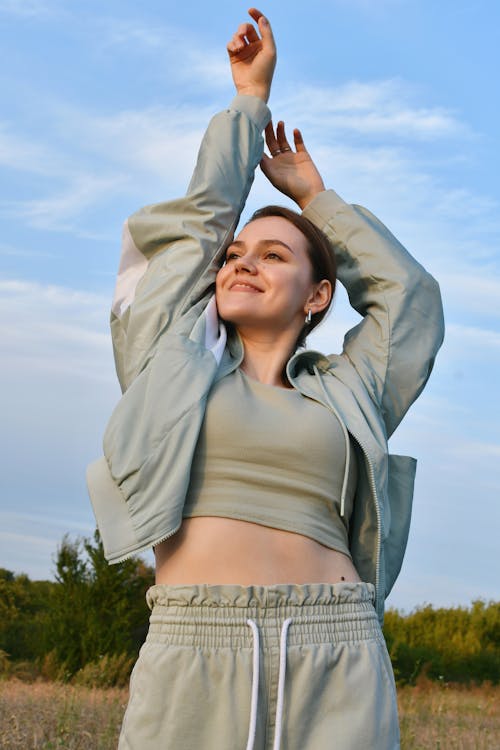 Woman Posing in Sportswear in Countryside