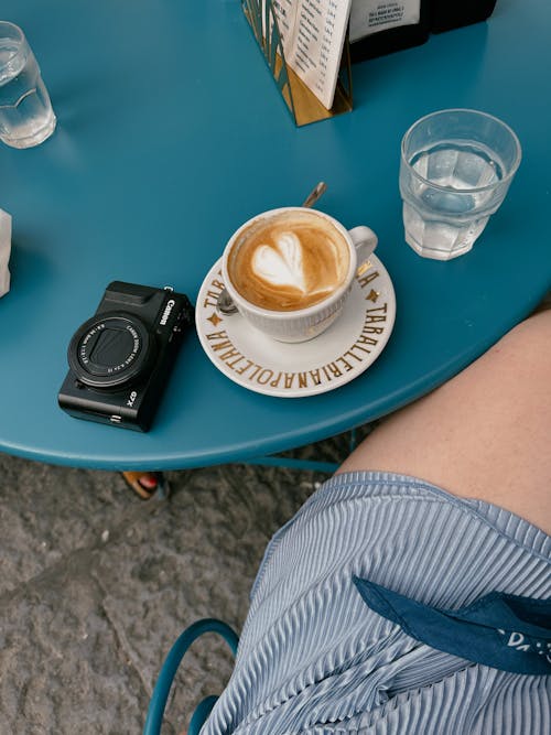 A Coffee and Camera on the Table 