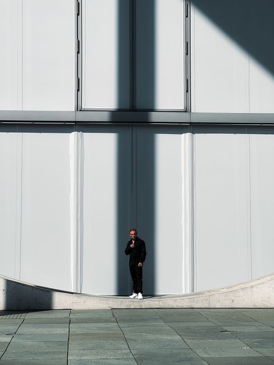 Man With Building A Man Standing in front of a Modern Building · Free Stock Photo