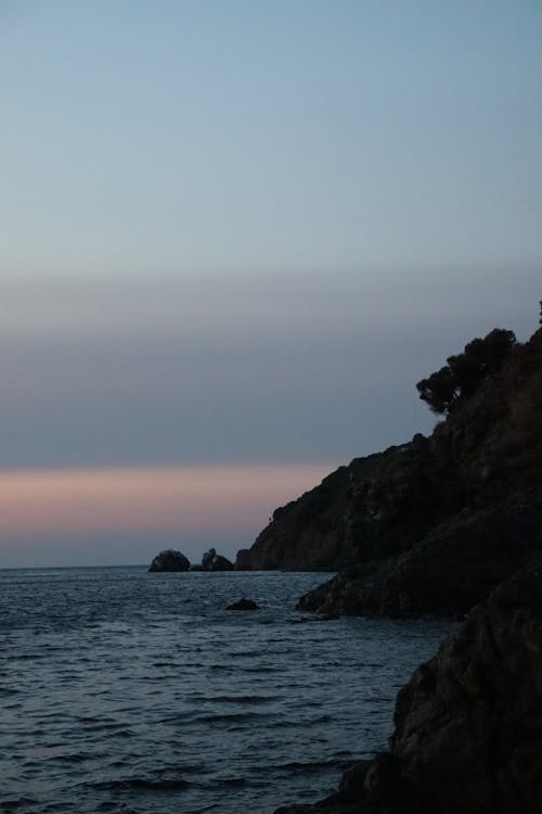 View of a Rocky Shore at Sunset 