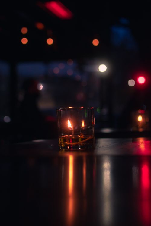 Free Candlelight reflecting in a dark, moody setting in Buenos Aires, Argentina. Stock Photo