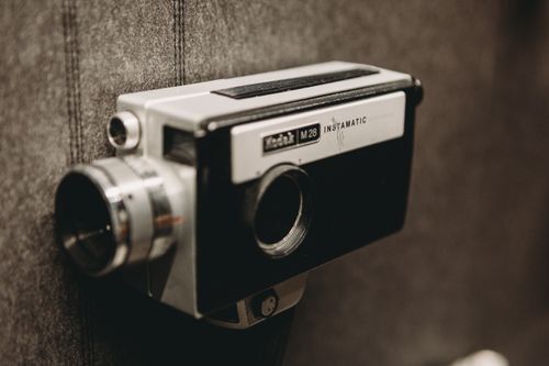 Free Close-up of a classic Kodak Instamatic camera with a retro design, ideal for vintage photography themes. Stock Photo