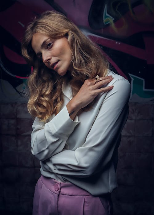 Blonde Woman Standing with Arms Crossed