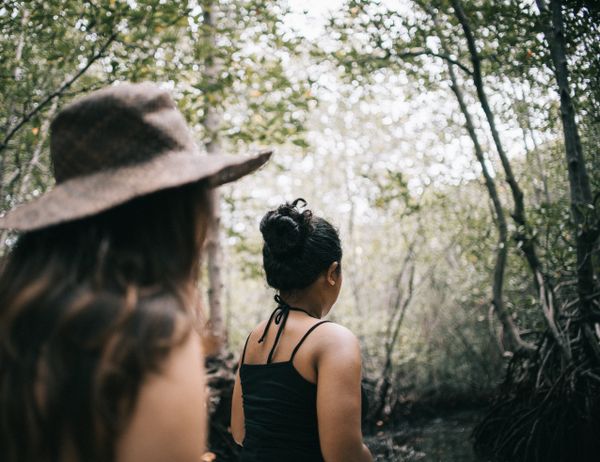 Walking a forest path after an outdoor yoga session