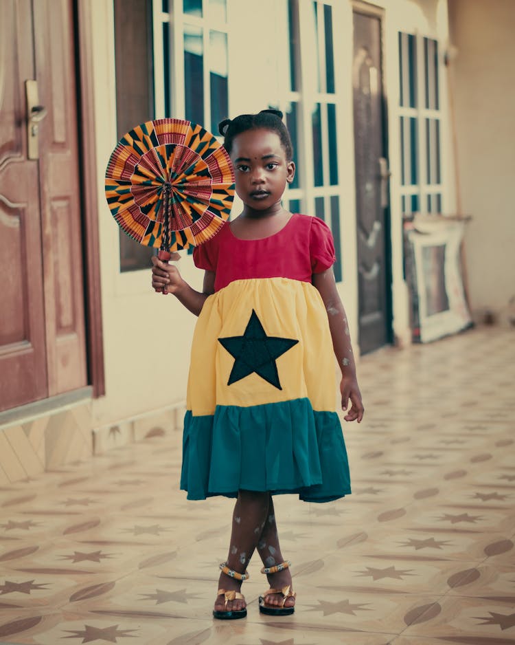 Girl In Dress In Colors Of Ghana