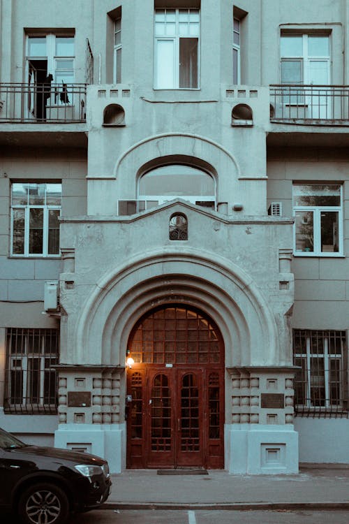 Exterior of an Apartment Building with Wooden Arch Door 