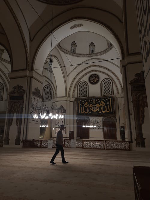 Man Walking in Grand Mosque of Bursa