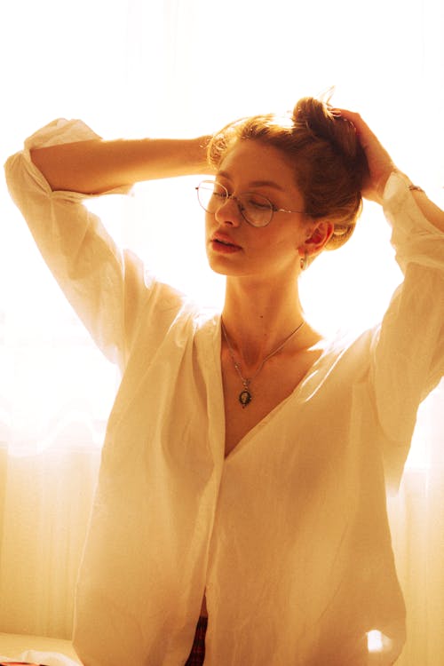 Model Wearing Eyeglasses and White Blouse
