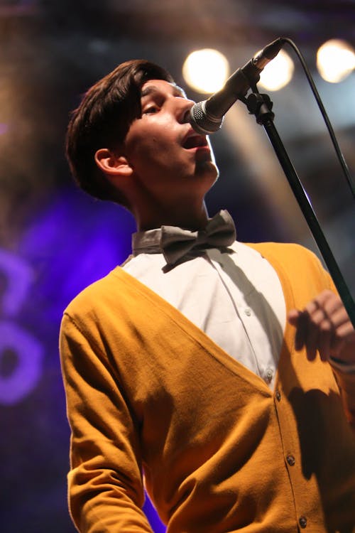 Close-Up Photo of Man Singing