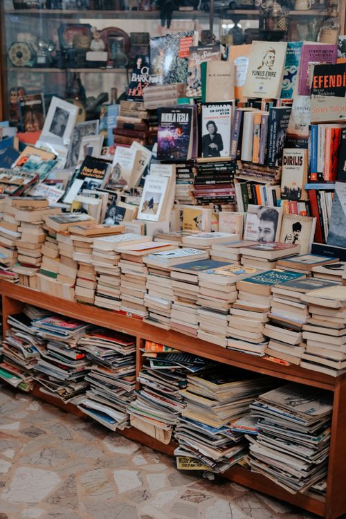 Free A bookstore filled with stacked, diverse books and literature for avid readers. Stock Photo
