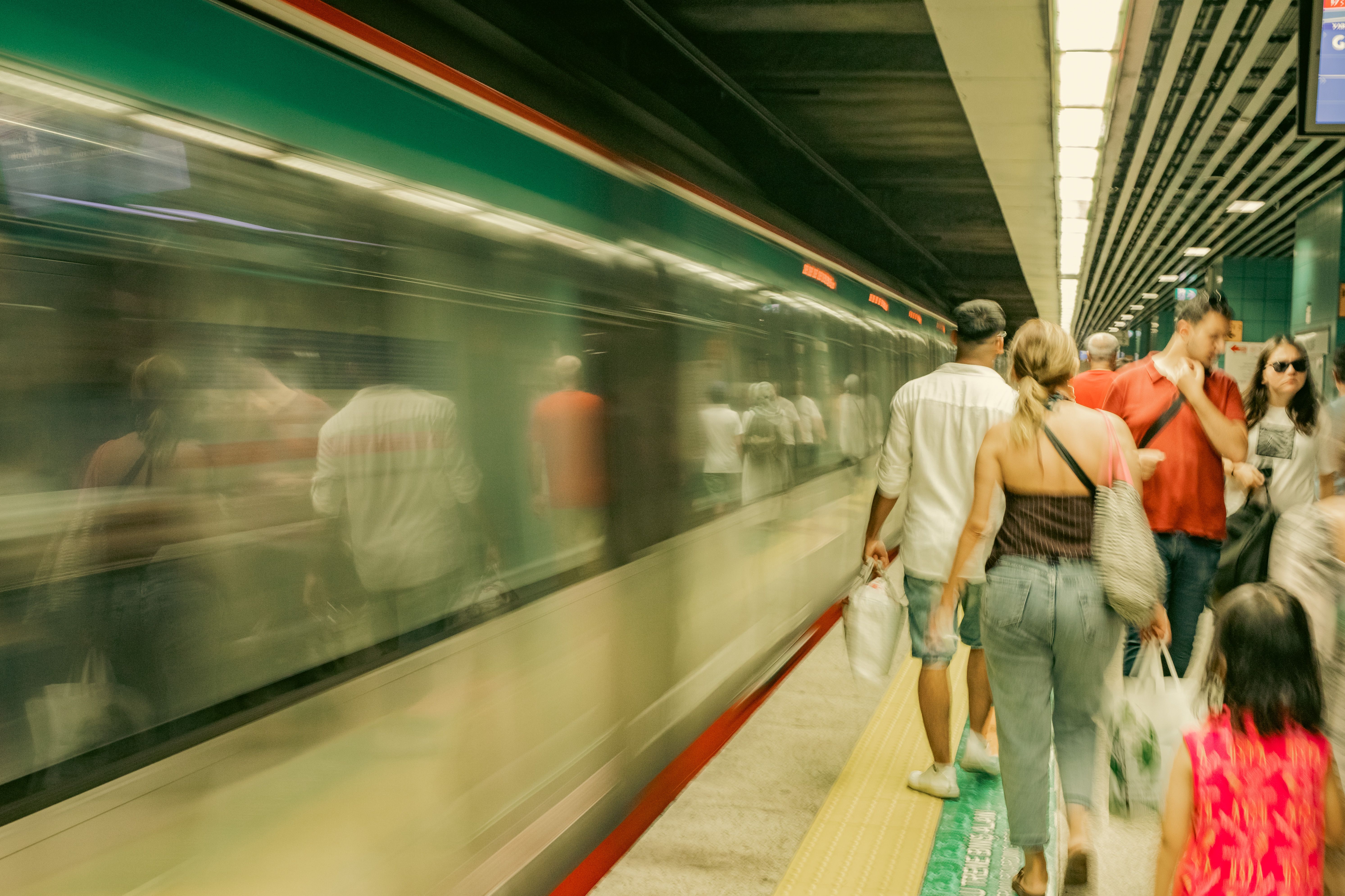 People waiting at a modern metro station in Rome, Italy.