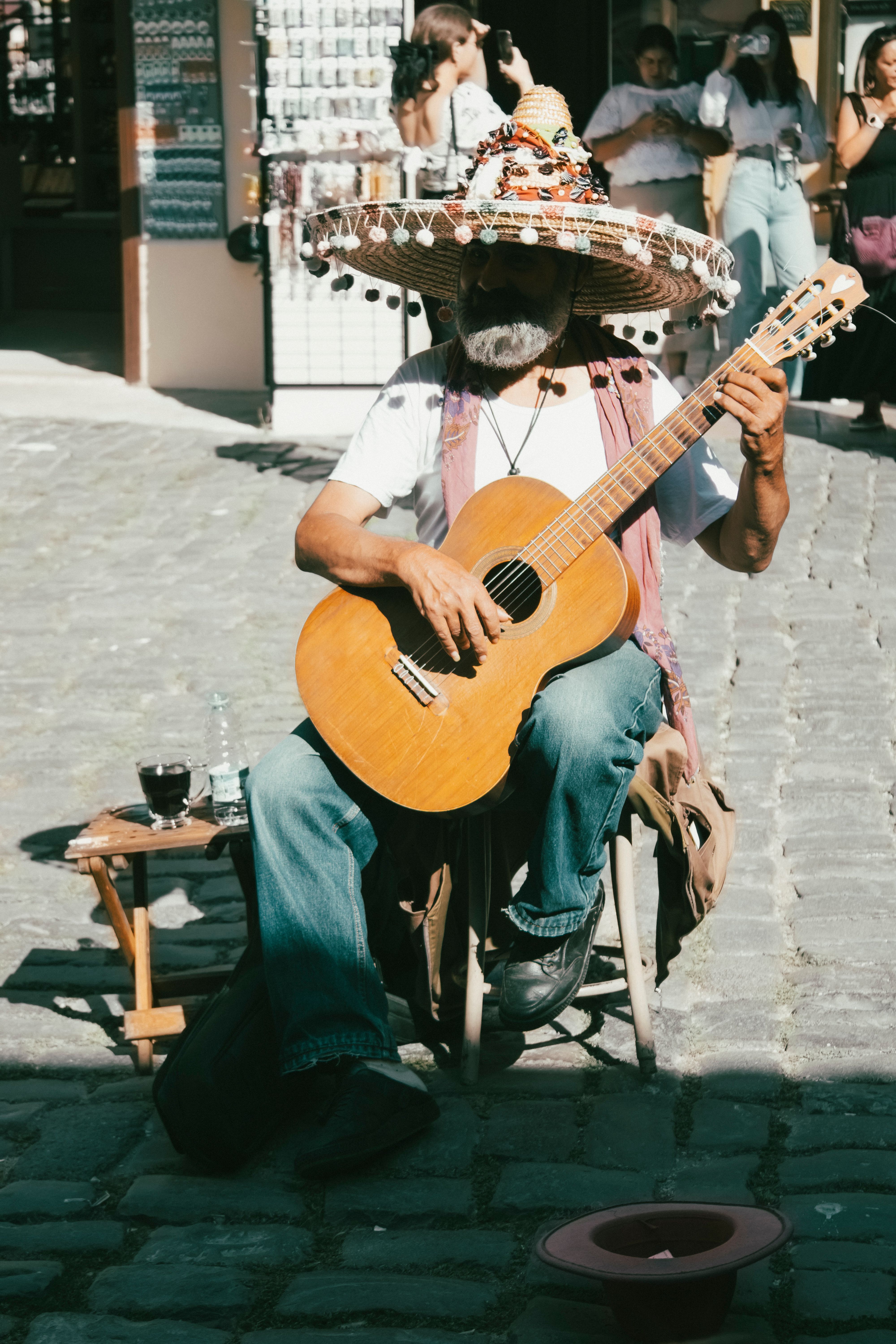 Man in Sombrero Playing Guitar on Street · Free Stock Photo