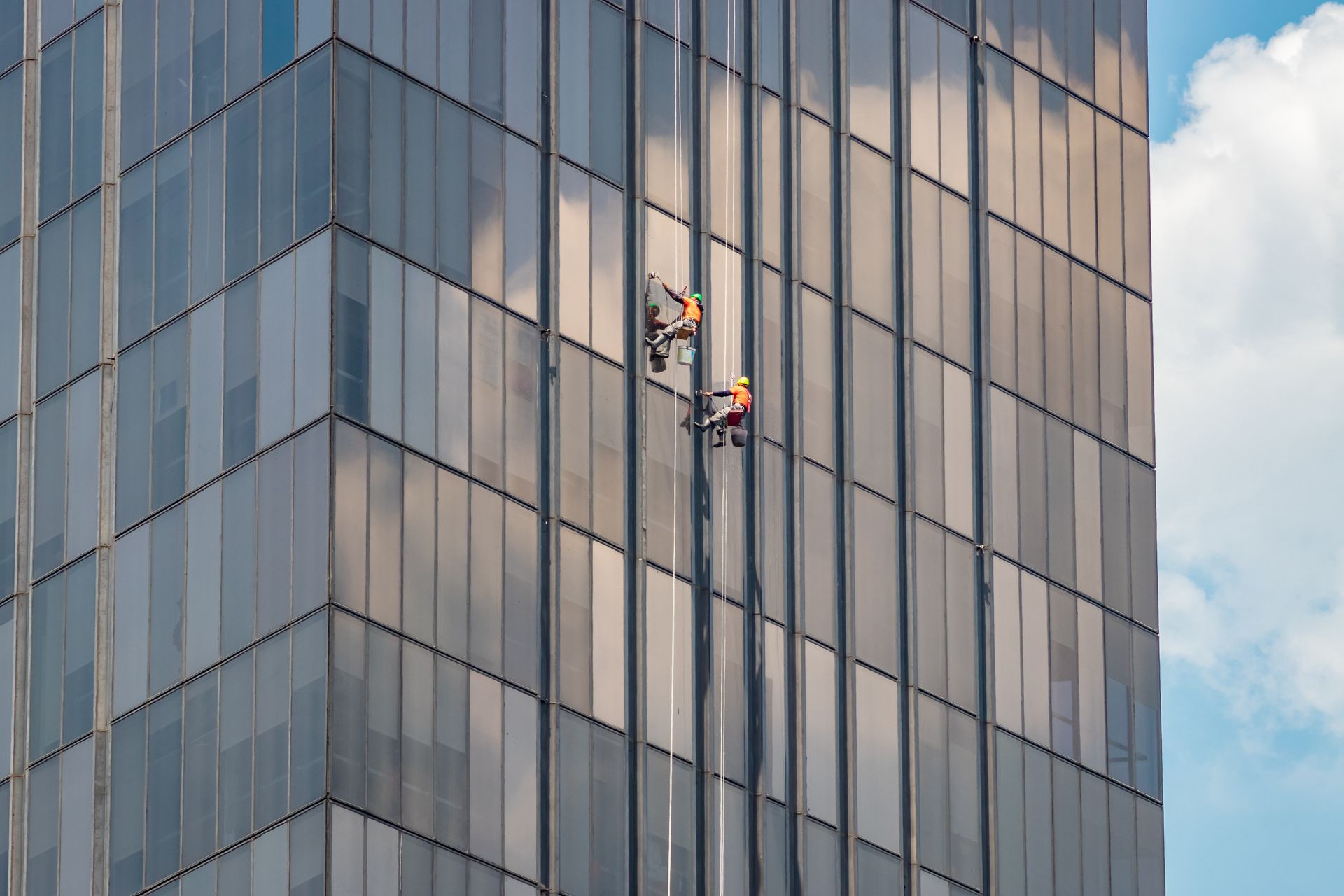 Men Cleaning Office Windows