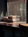 Books on Table by Window