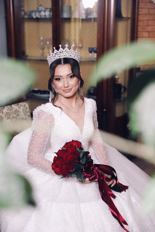 Smiling Bride in Crown and Wedding Dress