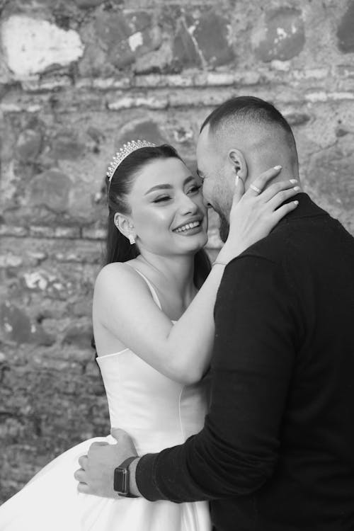 Smiling Newlyweds Hugging in Black and White