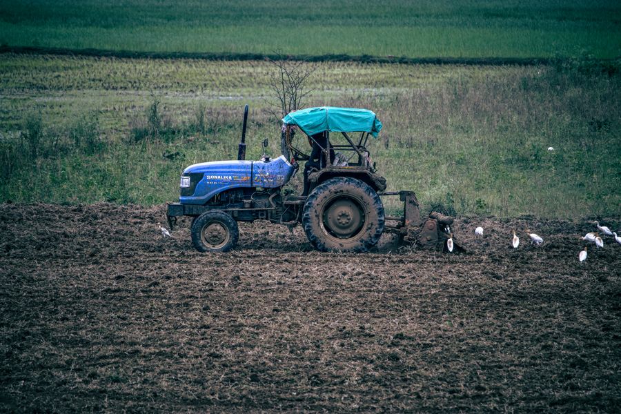 Tractor plowing a field in rural India