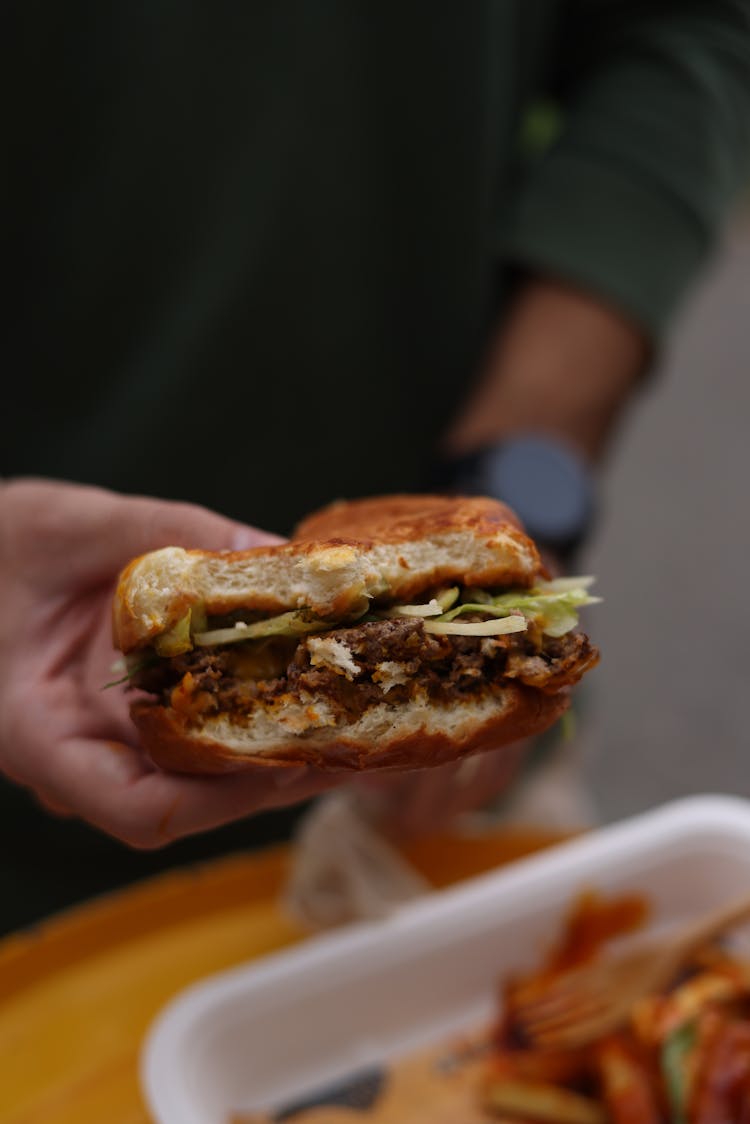 Man Holding Burger