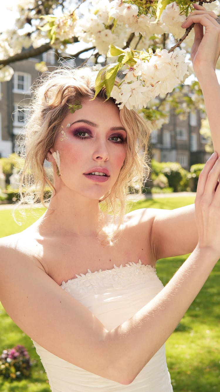 Blonde Woman With Spring Blossoms