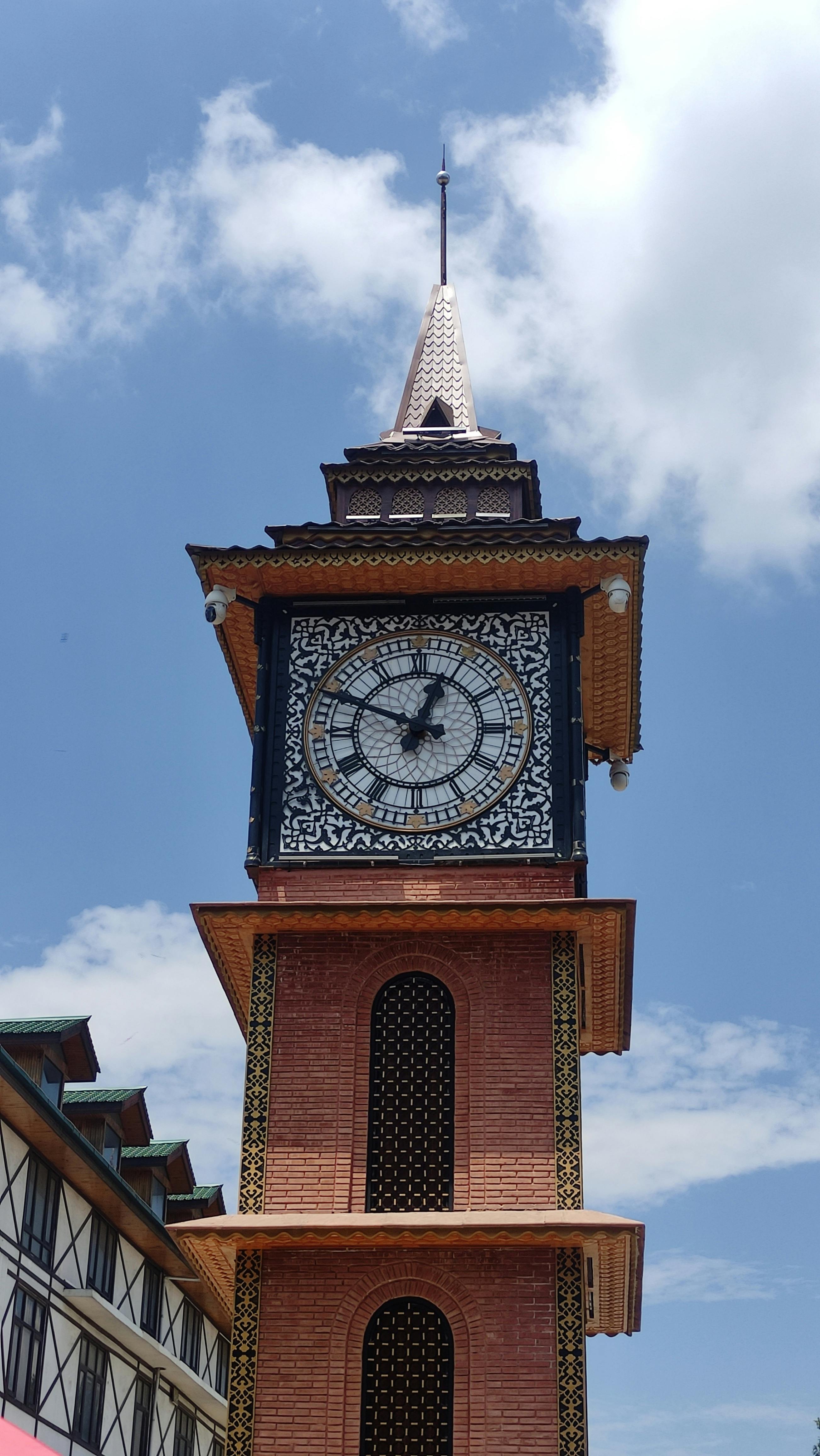 Ornamented Building of Clock Tower · Free Stock Photo