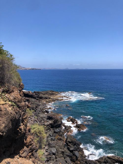 Free Explore the stunning coastal rock formations and expansive ocean view in Funchal, Madeira. Stock Photo