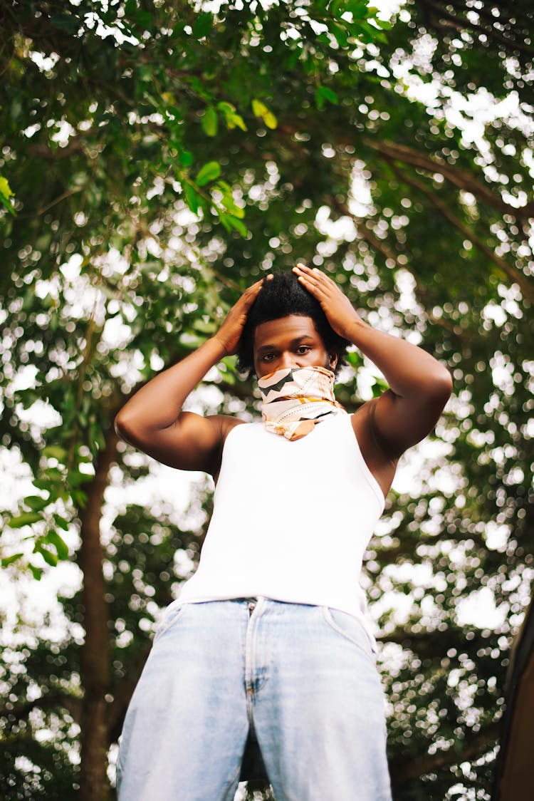 Young Man In A Casual Outfit Standing Outside