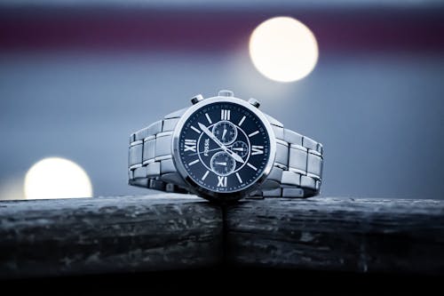 Silver Watch on Gray Background