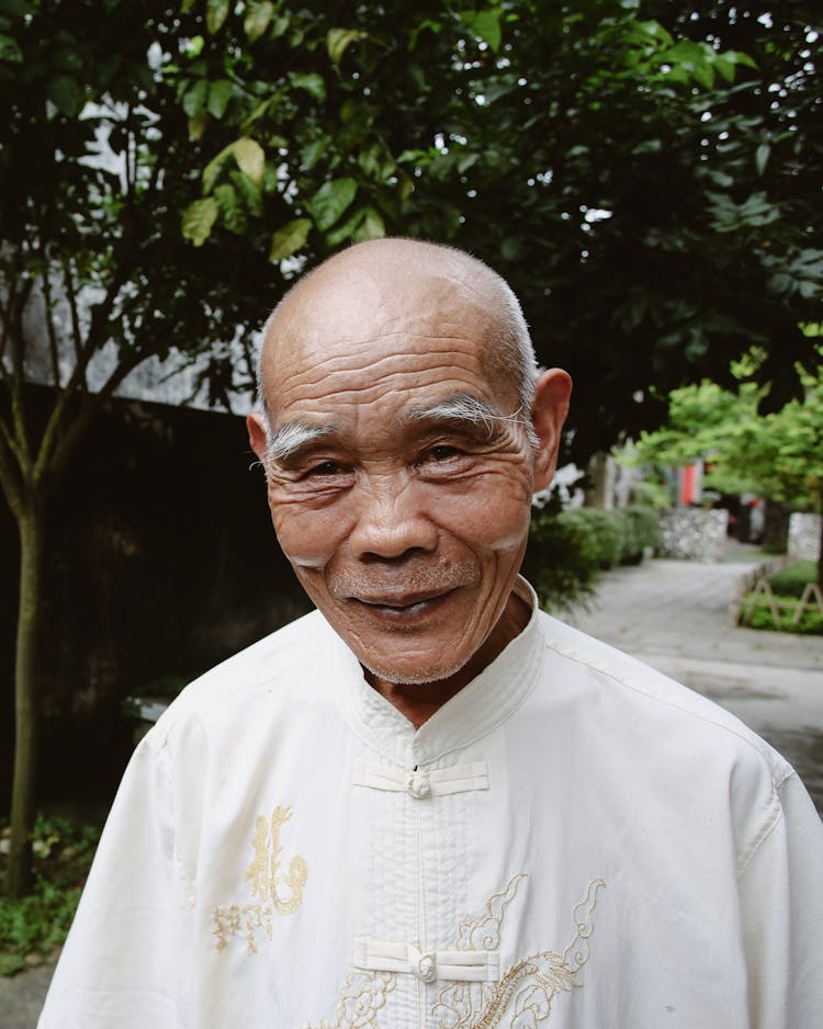 Elderly Man In A Traditional Tang Suit