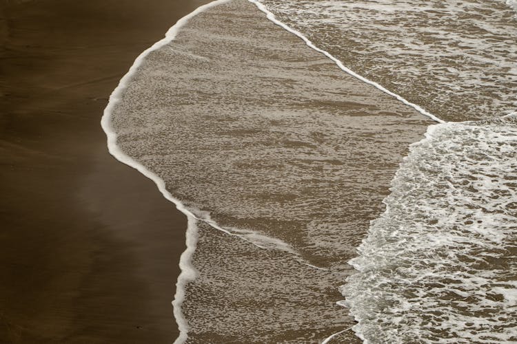 Waves Stroking Sandy Beach