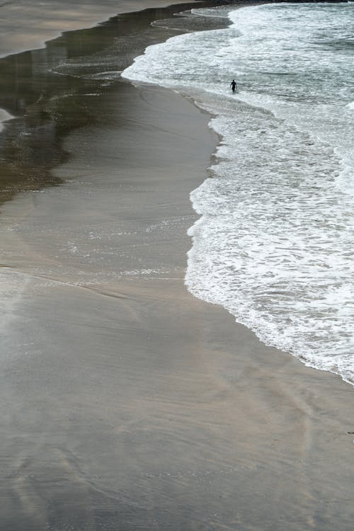 Close-up of Waves Washing Up the Beach