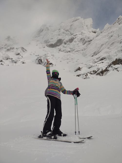 Person Skiing in Mountains