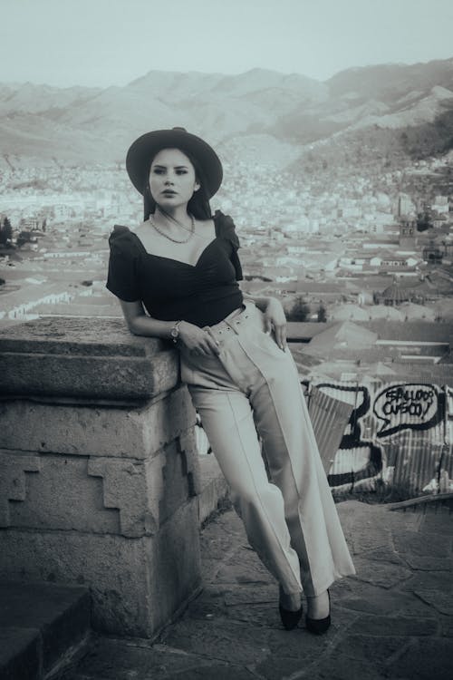 An Elegant Woman Standing on a Terrace 